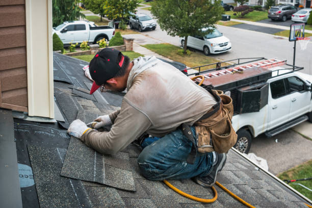 Professional Roofing technician working in Bourbon, IN